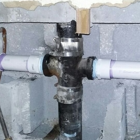 A set of pipes that have been repaired and replaced with PVC pipes.